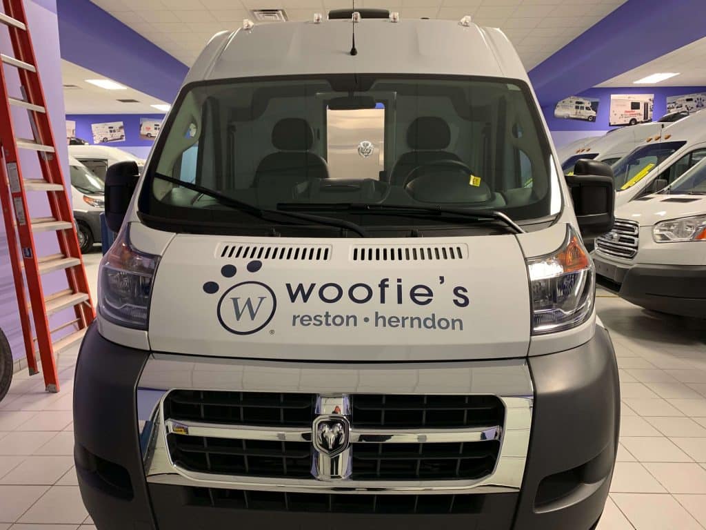 Reston herndon van with woofies's logo in front of it