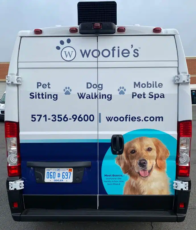 Woofie's van with a dog on the back