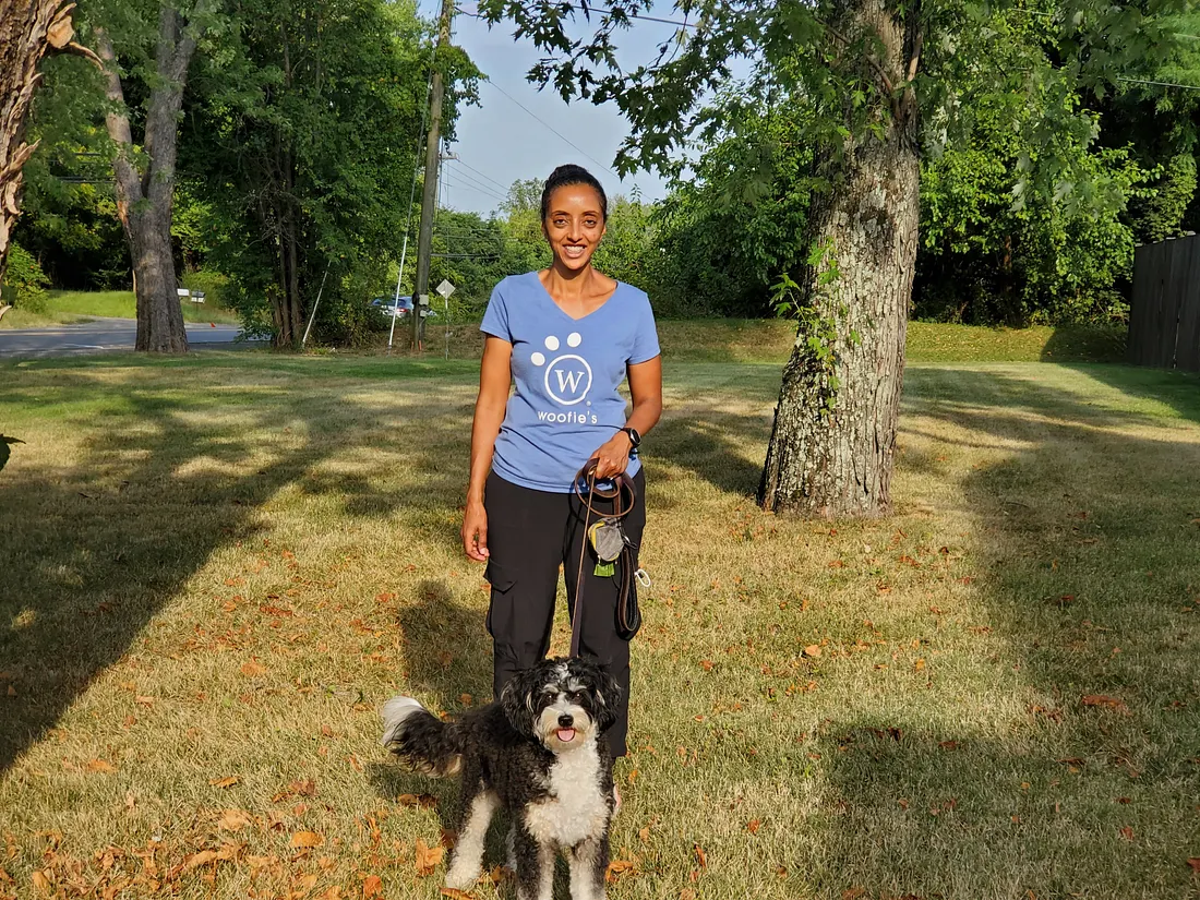 woofie's franchise owner walking a dog